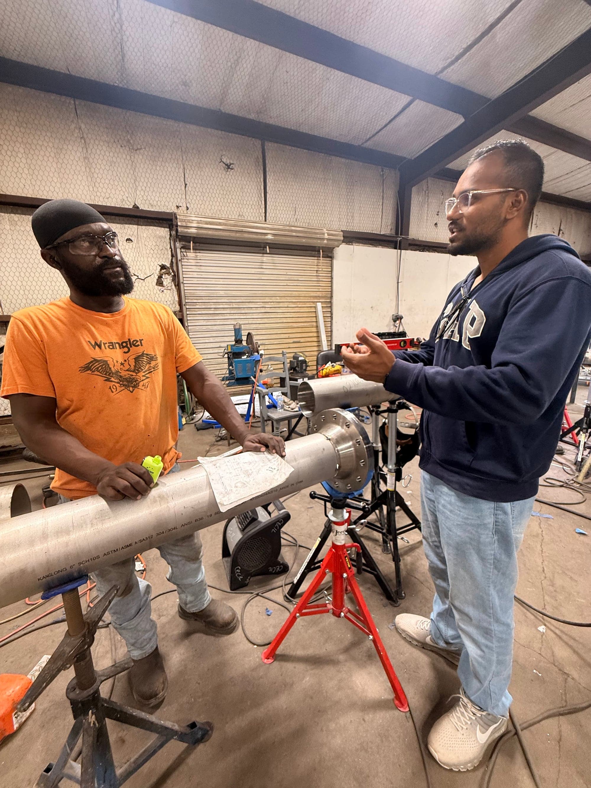 Field research with ground staff in the Cleburne welding bays